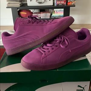 Purple Pumas sneakers